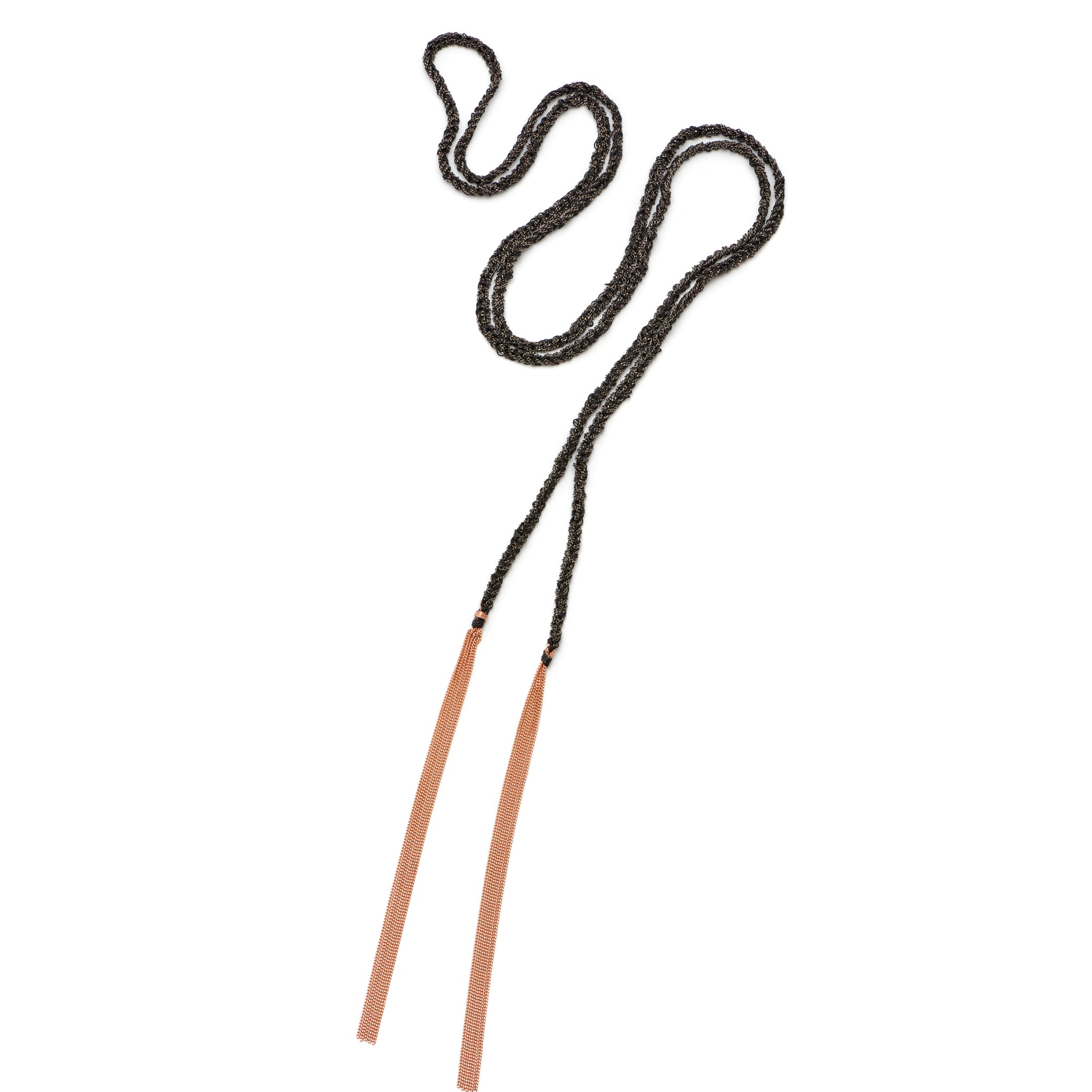 A black and rose gold tassel necklace with a braided design and two-tone finish. Adjustable tie necklace with tassels using 18ct rose gold plated vermeil on sterling silver.