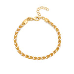 A 18ct gold plated vermeil and white silk braided Kuna bracelet with a lobster clasp closure.