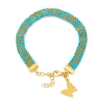 A turquoise silk weaved charm bracelet with a 18ct gold-plated vermeil on sterling silver chain and a gold charm in the shape of a butterfly and lobster clasp closure