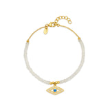18ct gold plated vermeil charm bracelet with moonstones and evil eye charm adorned with natural blue crystal and white zircon.