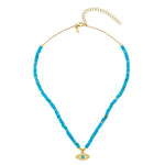 A turquoise and white zircon evil eye necklace with a 18ct gold plated vermeil sterling silver chain, made for stacking