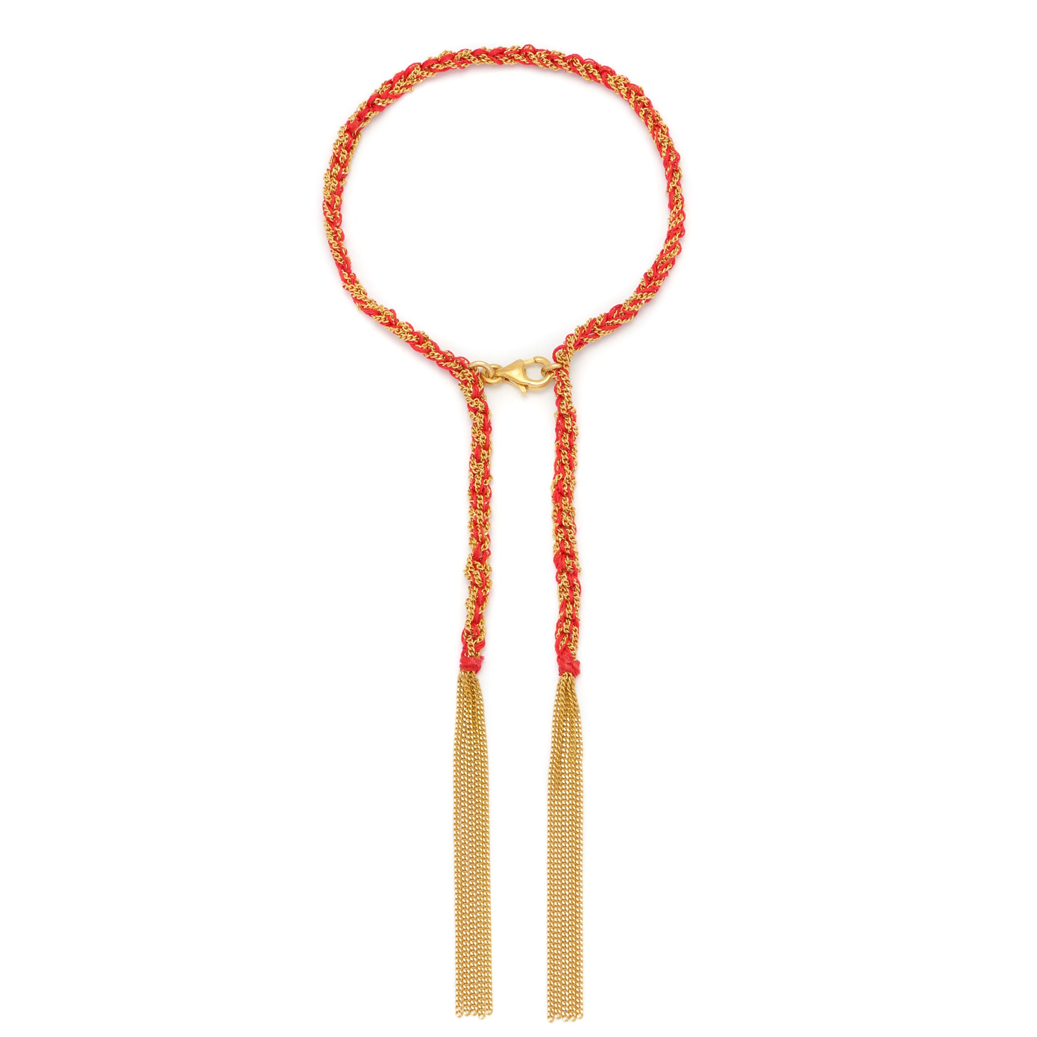 A 18ct gold vermeil and red silk tassel bracelet with a woven band and two hanging tassels.