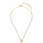 An 18ct gold plated vermeil on sterling silver necklace with a pyramid charm and a white zircon pave, featuring a gold and moonstone chain.