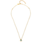 A 18ct gold plated vermeil necklace with a blue topaz and white diamond pave on a chain with a gold and pearl design.