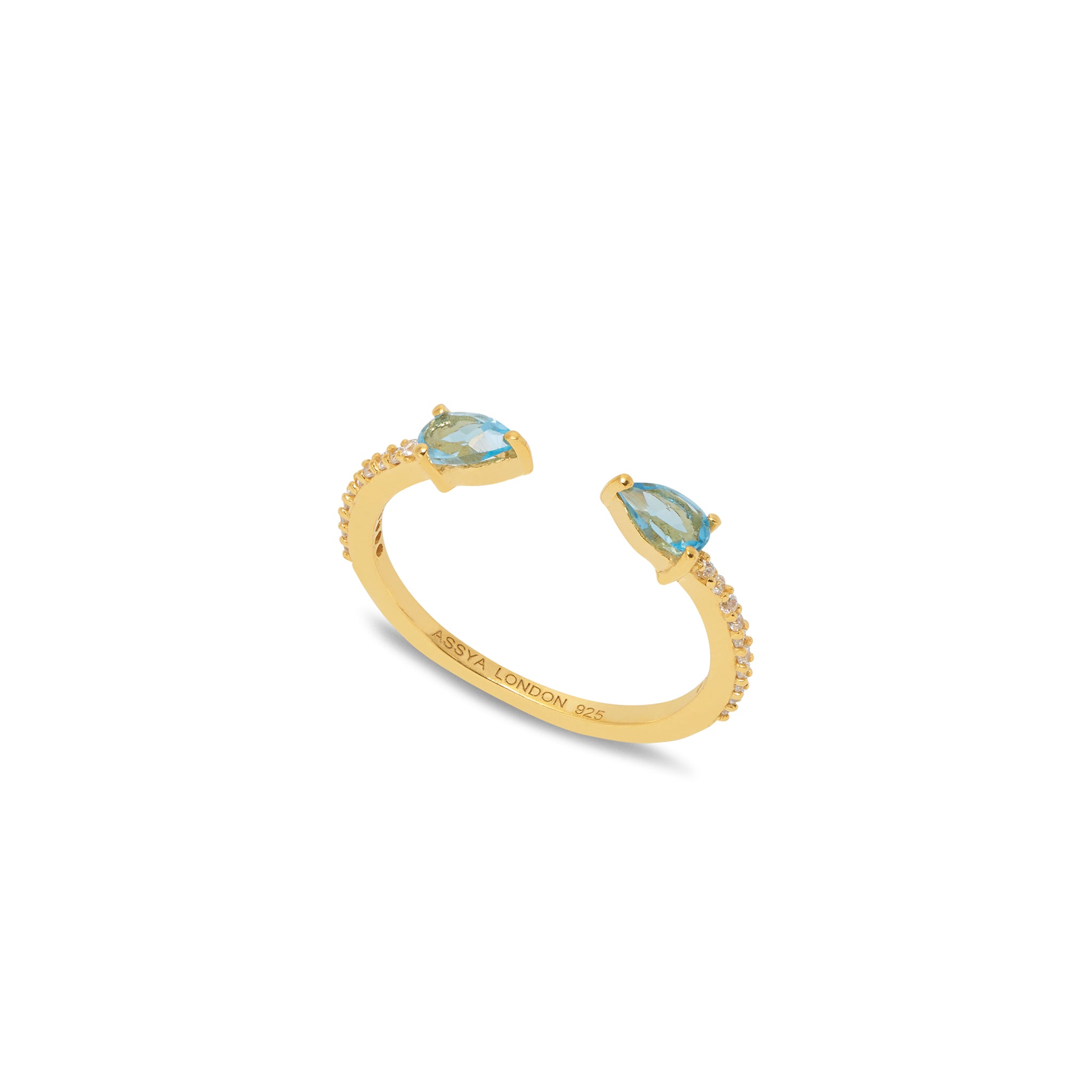 A 18ct gold plated vermeil open band ring with a central blue topaz and two smaller white zircons set in the band.