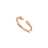 A rose gold ring with a white diamond and two pink sapphires set within a teardrop-shaped design.