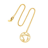 An 18kt gold necklace with a white diamond pendant featuring the constellation sign for Libra.