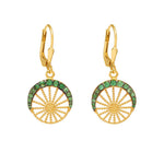 A pair of gold vermeil hoop earrings with green tsavorite stones set within the hoops.