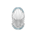 A Sterling Silver long ring with a central Blue Topaz pavé, surrounded by smaller clear crystals in a ribbed design.