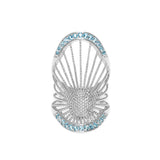 A Sterling Silver long ring with a central Blue Topaz pavé, surrounded by smaller clear crystals in a ribbed design.