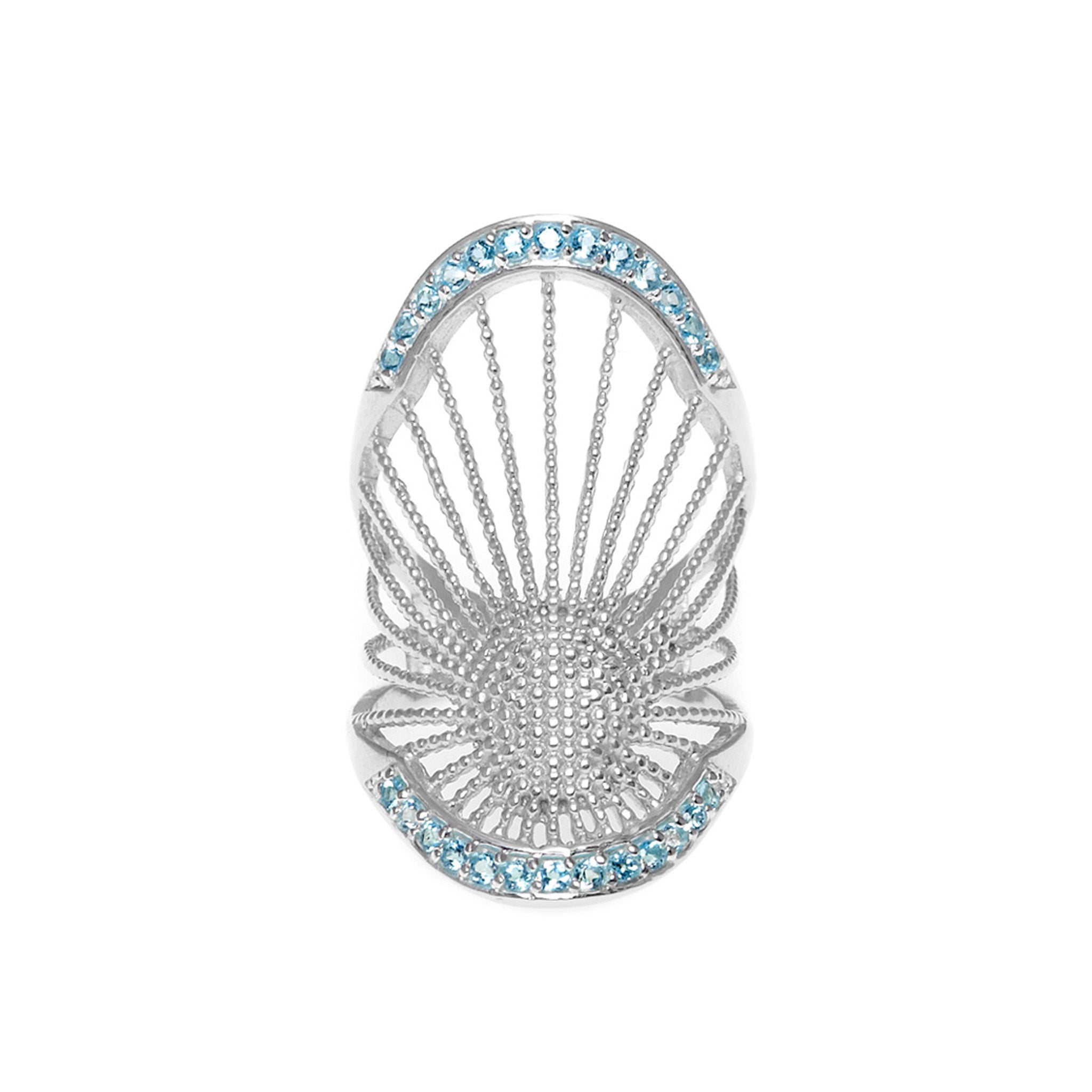 A Sterling Silver long ring with a central Blue Topaz pavé, surrounded by smaller clear crystals in a ribbed design.