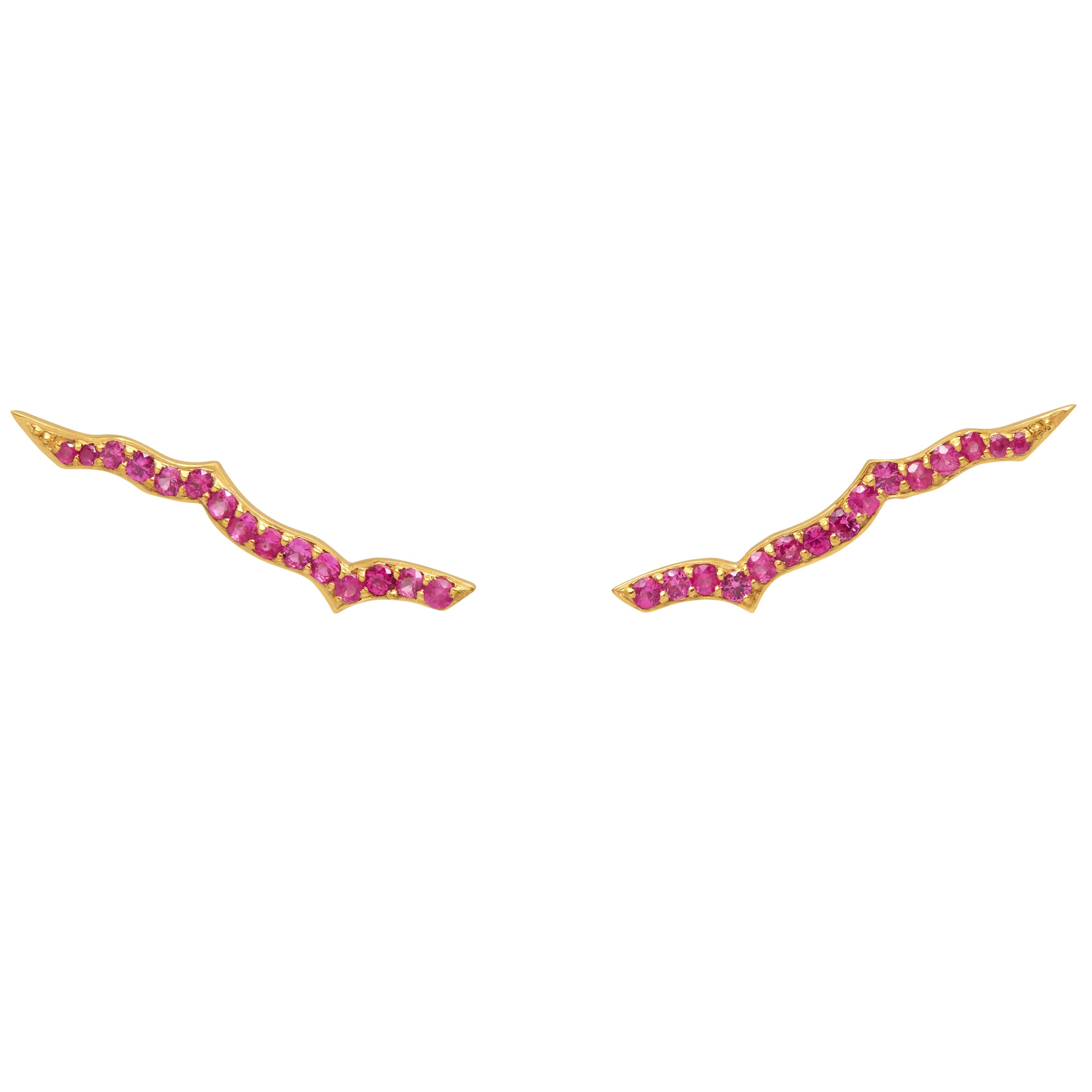 A pair of gold vermeil ear sliders with rubies set in them, designed to be worn as an ear accessory.