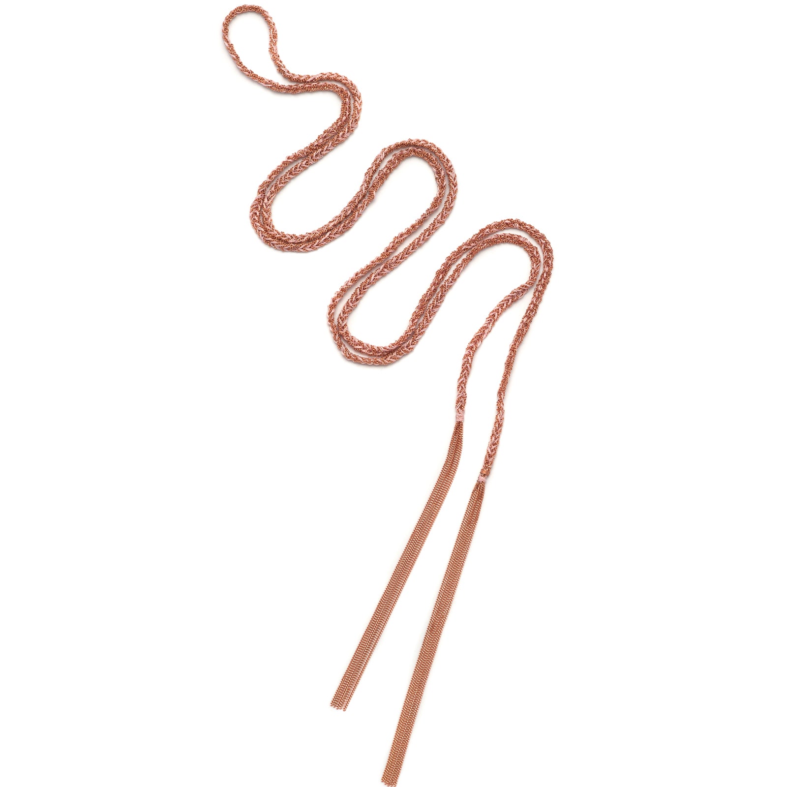 A 18ct gold plated vermeil and pink tassel necklace laid out on a plain background, showcasing its braided design and two tassel ends.