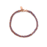 A hand-woven friendship bracelet with a combination of rose gold and purple elements, featuring a lobster clasp closure.