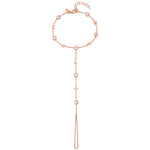 A 18ct plated rose gold hand bracelet with white zircon studs and a chain extension, featuring moon and star motifs.