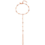 A 18ct plated rose gold hand bracelet with white zircon studs and a chain extension, featuring moon and star motifs.