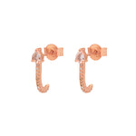 A pair of rose gold vermeil huggies with one studded with a grey diamond and the other with a teardrop-shaped morganite gemstone.