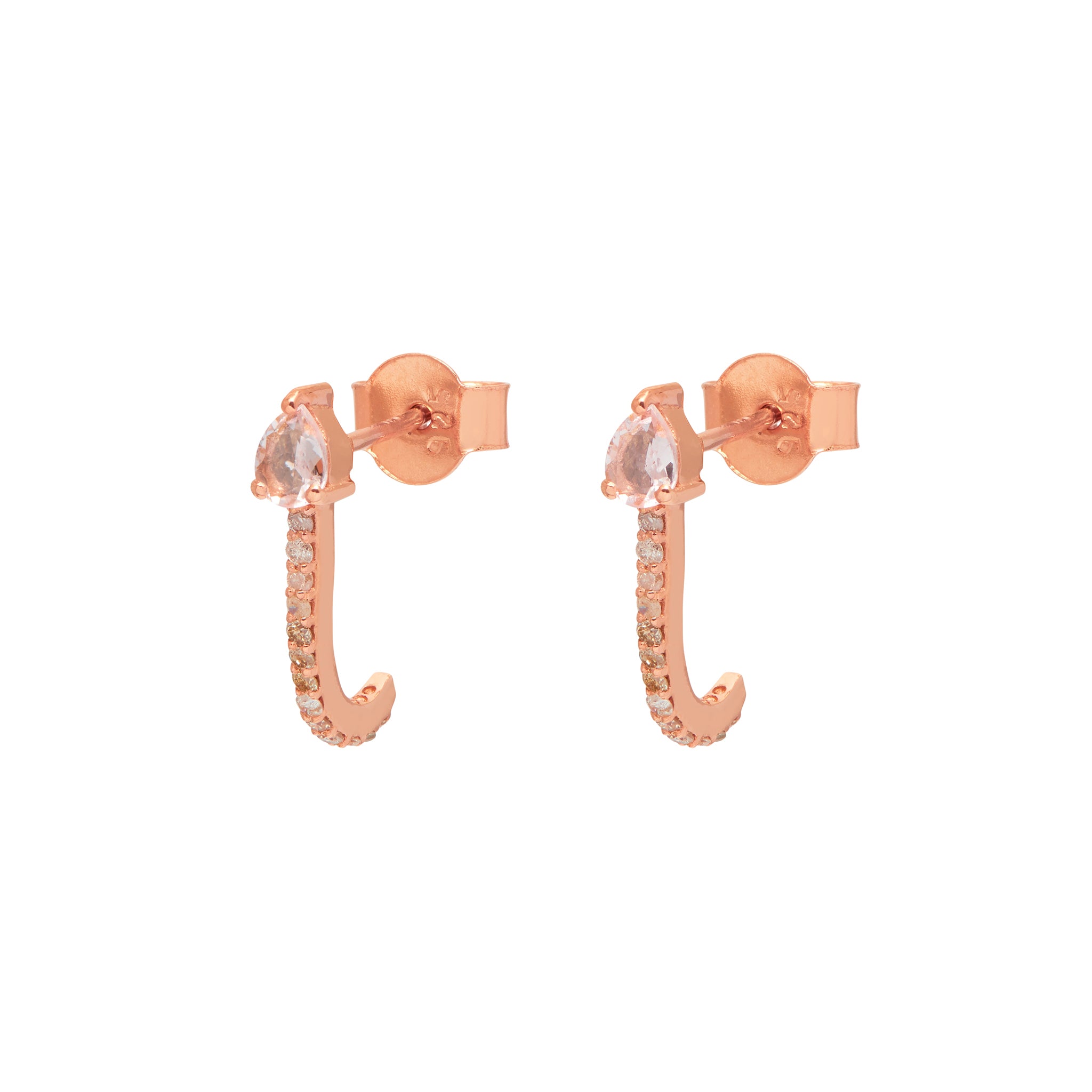 A pair of rose gold vermeil huggies with one studded with a grey diamond and the other with a teardrop-shaped morganite gemstone.
