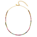 A necklace with a combination of pink and green tourmaline gemstones and 18ct gold vermeil nuggets on a short chain.