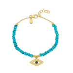 18ct gold vermeil plated silver with natural turquoise crystals and an evil eye pendant. Bracelet made for stacking.