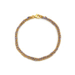 A Gold & Lilac Friendship Bracelet with a gold vermeil chain and purple silk thread,