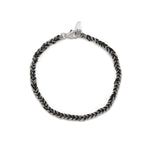 A silver and black friendship bracelet with a lobster clasp closure, hand woven with black silk and sterling silver chains.