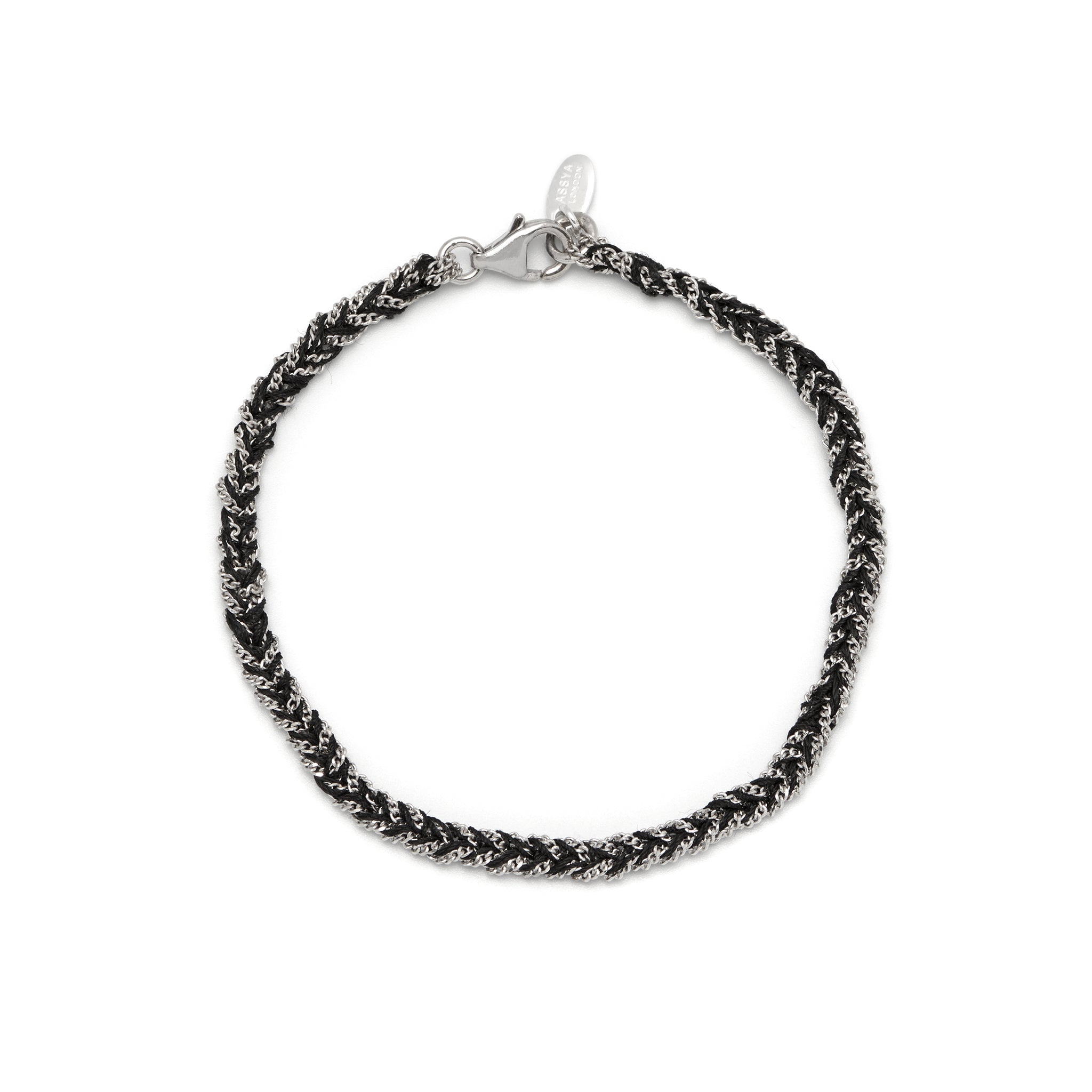 A silver and black friendship bracelet with a lobster clasp closure, hand woven with black silk and sterling silver chains.