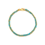 A 18ct gold vermeil and turquoise friendship bracelet with a lobster clasp closure, hand woven on an Italian loom using a Florentine technique.