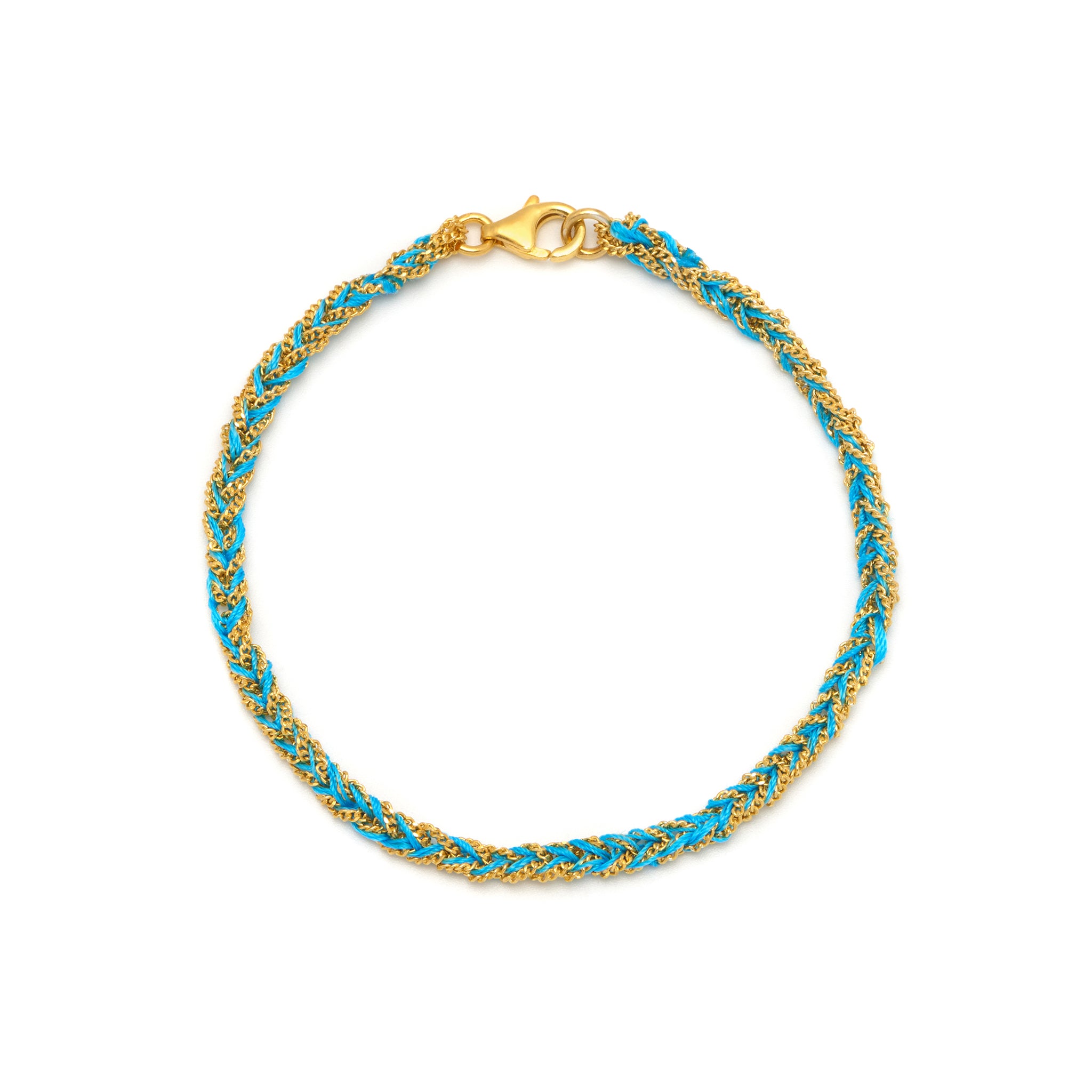 A 18ct gold vermeil and turquoise friendship bracelet with a lobster clasp closure, hand woven on an Italian loom using a Florentine technique.