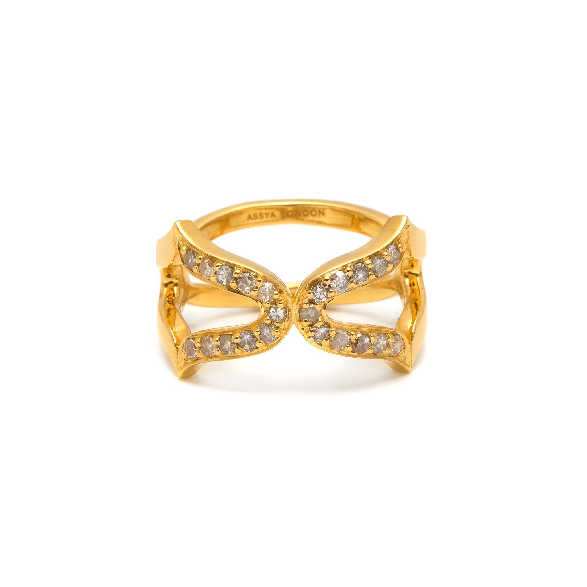 An 18ct gold vermeil ring with a black rhodium setting, featuring a cross design with grey diamonds