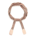 A bracelet with a rose gold and grey silk weave, featuring a double knot wrap and a brand tag.