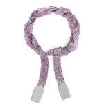 A silver and purple silk wrap bracelet tied in a knot
