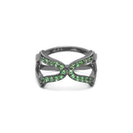 An 18ct gold vermeil ring with a black rhodium setting, featuring a cross design with green tsavorite
