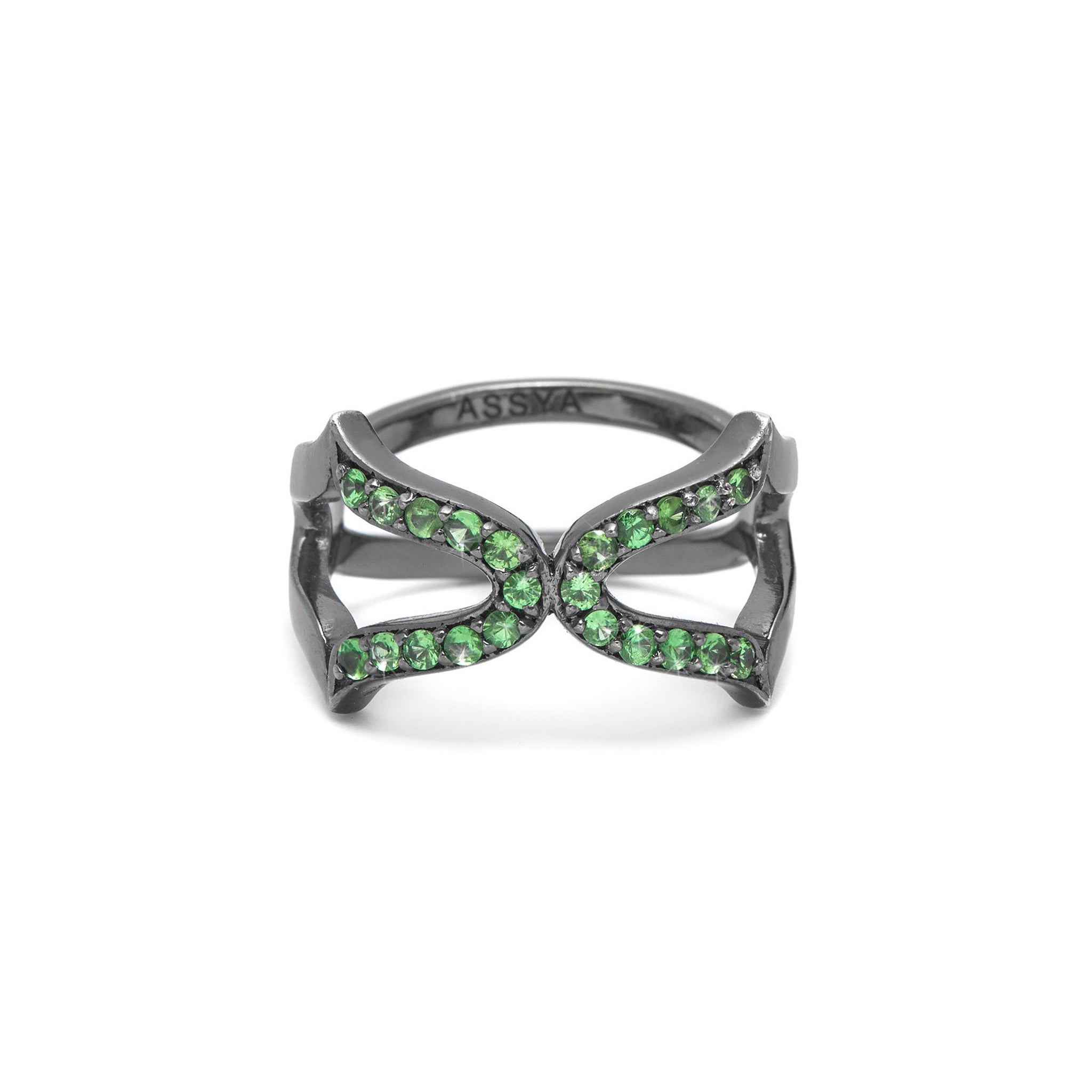 An 18ct gold vermeil ring with a black rhodium setting, featuring a cross design with green tsavorite