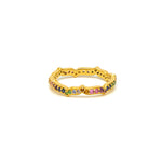A gold vermeil eternity ring with pavé set with multicolored gemstones.