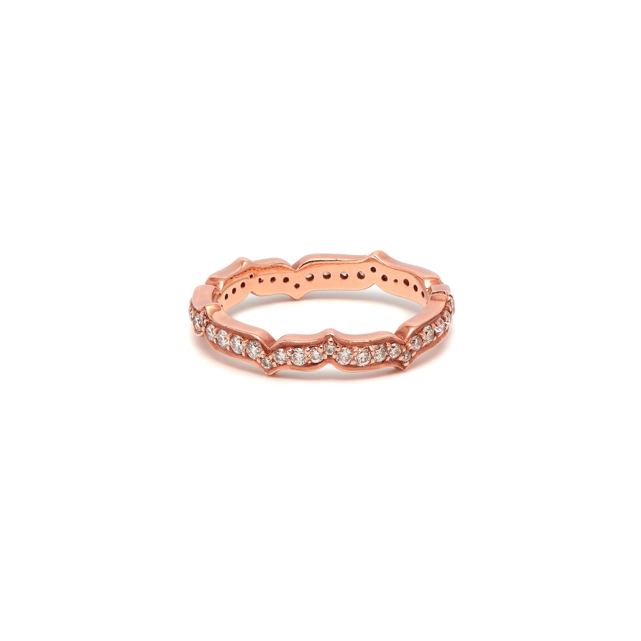 An 18ct rose gold eternity ring with white diamond accents from the Oriental Collection.