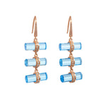 A pair of rose gold vermeil barrel-cut blue topaz earrings with sparkling white diamond pave'.