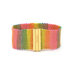 18ct gold plated vermeil with multicoloured rainbow silk weaved into a bracelet cuff 3cm thick.