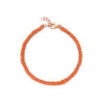 A hand-woven orange silk and 18ct rose gold plated silver friendship bracelet with a clasp.