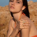 Model Wearing Assya London Crystal Rings in bathing suit